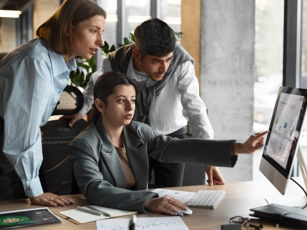 people-analyzing-checking-finance-graphs-office